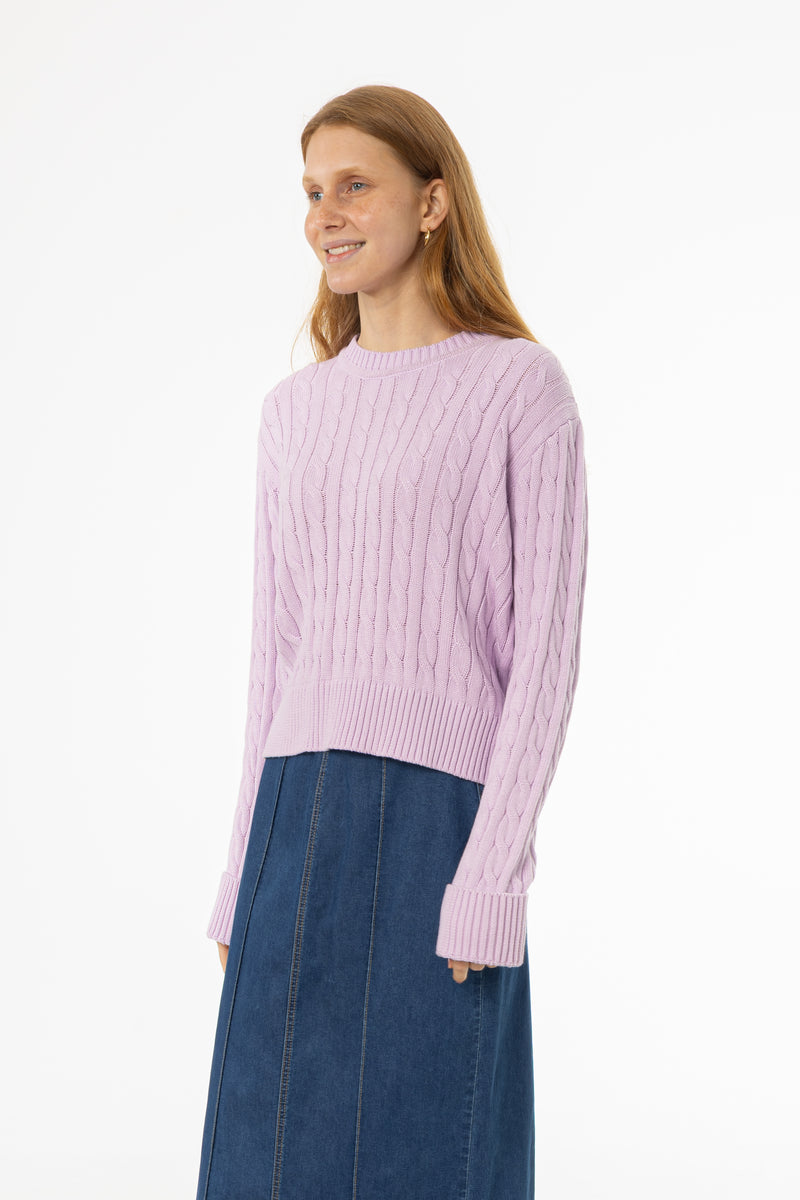 Soft lavender cable knit sweater with round neckline