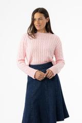 Soft pink cable knit sweater with round neckline